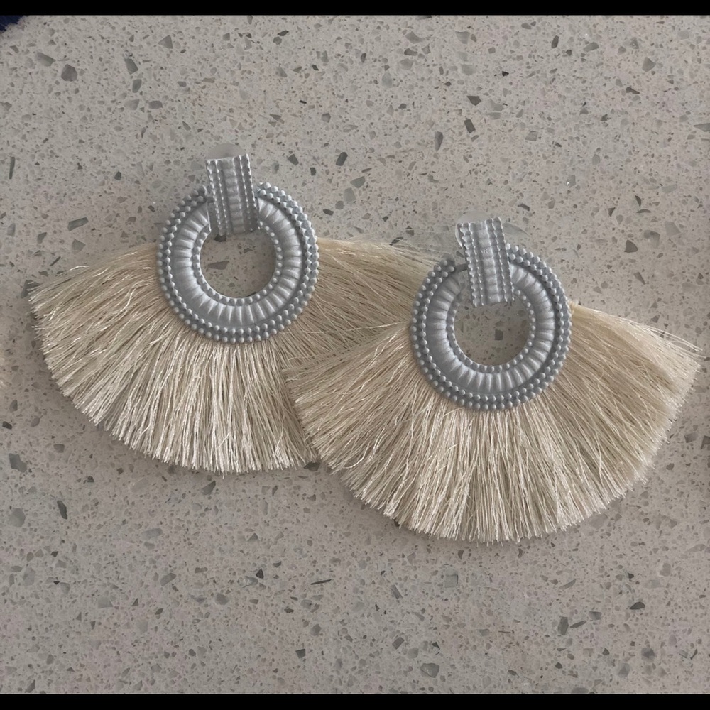 White tassle earrings